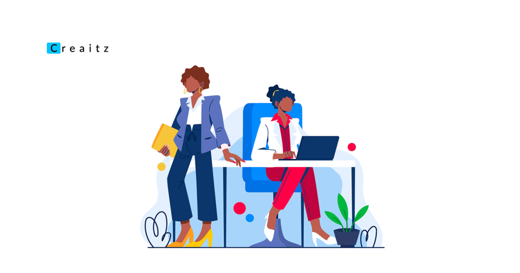 Professional women discussing career growth strategies while working together at a modern office desk with laptop